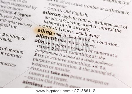 The Word Or Phrase Ailing In A Dictionary Highlighted With Marker.
