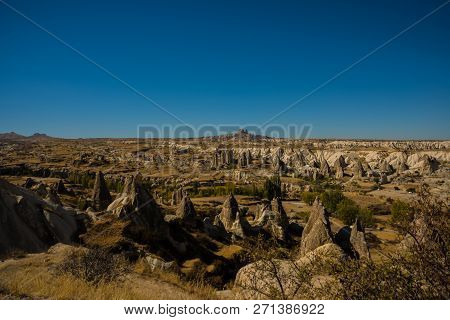 Cappadocia, Turkey: Beautiful Landscape On The Panorama Of Mountains And Rocks. The Fortress Of Uchi