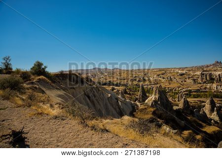 Cappadocia, Turkey: Beautiful Landscape On The Panorama Of Mountains And Rocks. The Fortress Of Uchi