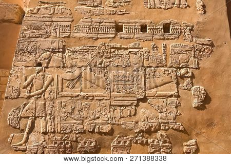 Egyptian Hieroglyphs And Drawings On The Walls And Columns. Egyptian Language, The Life Of Ancient G