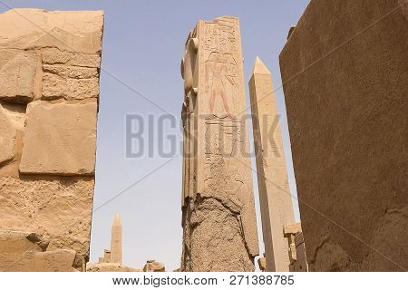 Egyptian Hieroglyphs And Drawings On The Walls And Columns. Egyptian Language, The Life Of Ancient G