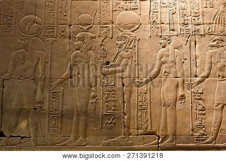 Egyptian Hieroglyphs And Drawings On The Walls And Columns. Egyptian Language, The Life Of Ancient G