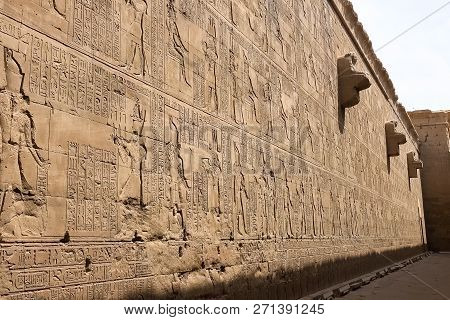 Egyptian Hieroglyphs And Drawings On The Walls And Columns. Egyptian Language, The Life Of Ancient G