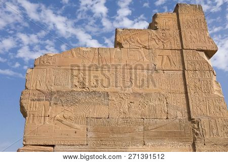 Egyptian Hieroglyphs And Drawings On The Walls And Columns. Egyptian Language, The Life Of Ancient G