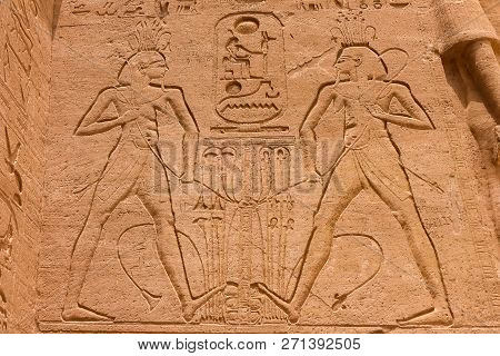 Egyptian Hieroglyphs And Drawings On The Walls And Columns. Egyptian Language, The Life Of Ancient G