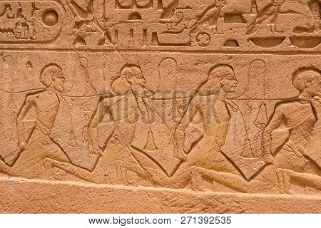 Egyptian Hieroglyphs And Drawings On The Walls And Columns. Egyptian Language, The Life Of Ancient G