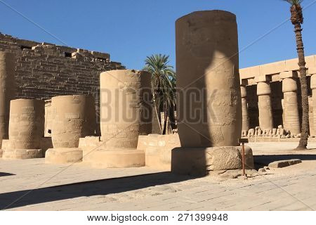 Buildings And Columns Of Ancient Egyptian Megaliths. Ancient Ruins Of Egyptian Buildings