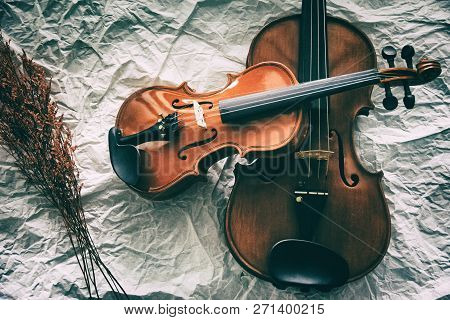 The Abstract Artdesign Background Of Two Different Size Of Violins Put On Background,show Detail Of 