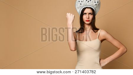 Cute Woman Shows Fist At Camera, Threatens You About Something, Has Displeased Sullen Facial Express