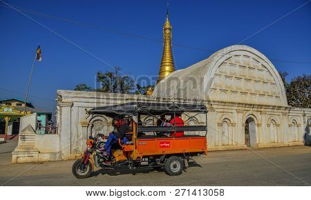 Nyaungshwe, Myanmar - Feb 8, 2017. A Local Bus On Street Near White Temple Of Shwe Yan Pyay Monaster
