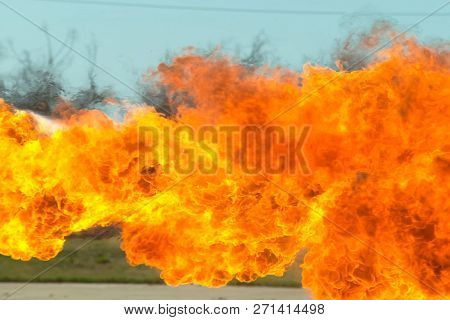 Flame Tongues From The Flamethrower. Background Of Fire.
