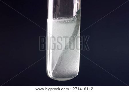 Laboratory Flask With A Tungsten Plate In Alkali.