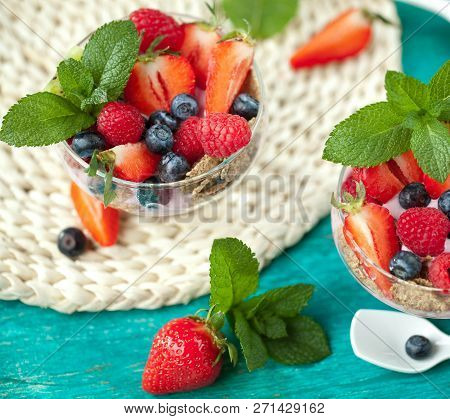 Summer Dessert With Strawberries On A Wooden Background.