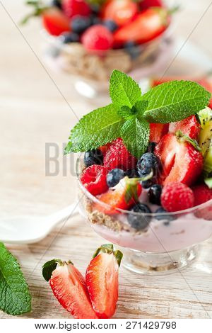 Summer Dessert With Strawberries On A Wooden Background.