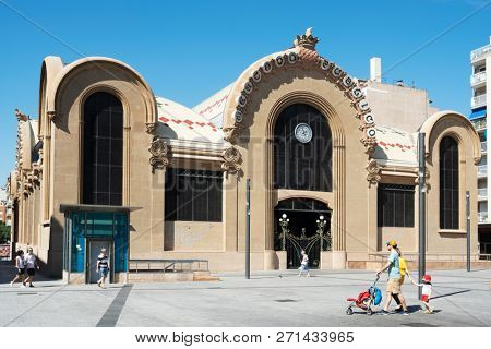 TARRAGONA, SPAIN - SEPTEMBER 23, 2018: A view of the main facade of the historical Central Public Market of Tarragona, and the Corsini Square, in Tarragona, Spain