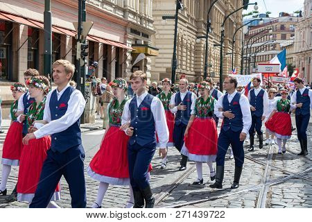Prague, Czech Republic - July 1, 2018: People In Folk Costumes Parading At Sokolsky Slet, A Once-eve