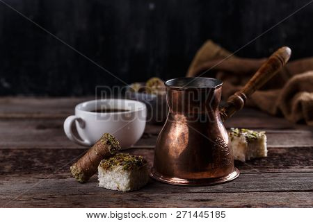 Traditional Turkish Coffee And Turkish Delight On Dark Wooden Backgroundm Copy Space