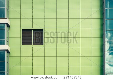 Beautiful Smooth Greenish Square Tiles Close-up. Light Green Texture Of Outside Wall Closely With Co