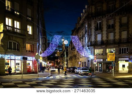 Strasbourg, France - Nov 29, 2017: Beautiful Christmas City Scene With Garland Over The Large Street