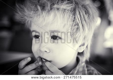 Baby Teeth. Adorable Blond Kid Is Playing, Making Fun Faces. Happy Childhood And Developed Imaginati