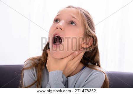 Portrait Of A Girl Unable To Breathe Pressing Her Neck