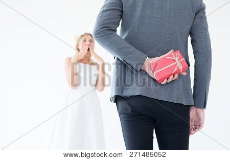 Groom Hiding Red Gift Box Behind Back In Order To Surprise Bride On The Wedding Day,woman Positive E