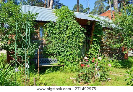 Small Summer Country House In The Shade Of Garden Trees