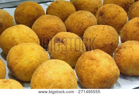 Sicilian Croquettes Of Rice Called Arancini In Italian Language Stuffed With Tomato Mozzarella And R