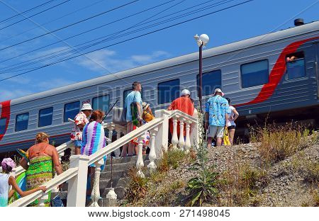 Golovinka, Sochi, Russia - August, 2015: People Returning From The Beach, Waiting For The Passage Of