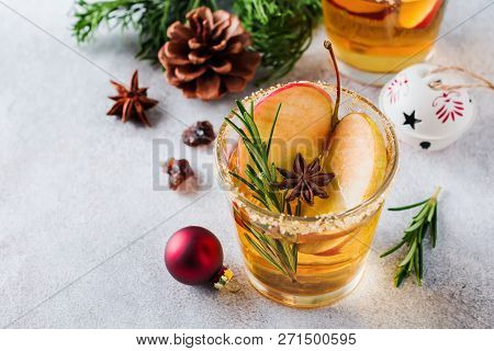 Traditional Christmas Apple Punch With Cinnamon, Anise And Sprigs Of Rosemary On Light Background. S