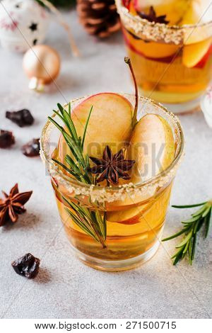 Traditional Christmas Apple Punch With Cinnamon, Anise And Sprigs Of Rosemary On Light Background. S