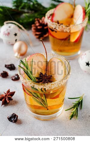 Traditional Christmas Apple Punch With Cinnamon, Anise And Sprigs Of Rosemary On Light Background. S