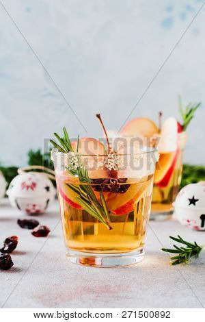 Traditional Christmas Apple Punch With Cinnamon, Anise And Sprigs Of Rosemary On Light Background. S