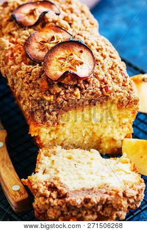 Homemade Apple Crumble Cake Served On A Wire Rack On A White Sto