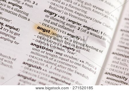 The Word Or Phrase Angst In A Dictionary Highlighted With Marker.