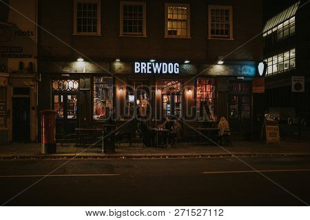 Brighton, England - October 26th, 2018: Night View Of Brewdog Brewery Pub Facade With People Sitting