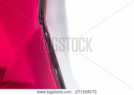 A Red Glass Surface Isolated Over A White Background.