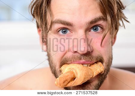 Handsome Young Man Enjoying His Morning Cup Of Coffee Laying In Bed Hotel Room Happy Smiling. Handso