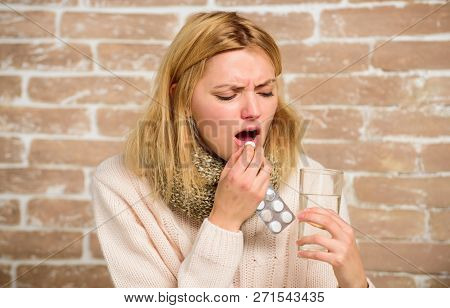 Headache And Fever Remedies. Woman Tousled Hair Scarf Hold Glass Water And Tablets Blister. Take Med