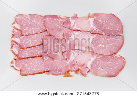 Meat Sliced In A Rectangular Shape On A Light Background