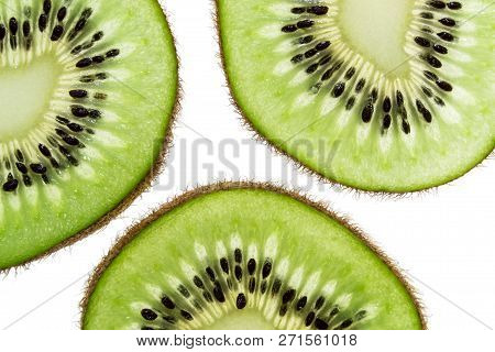 Sliced Kiwifruit Rings On White Background Top View Macro