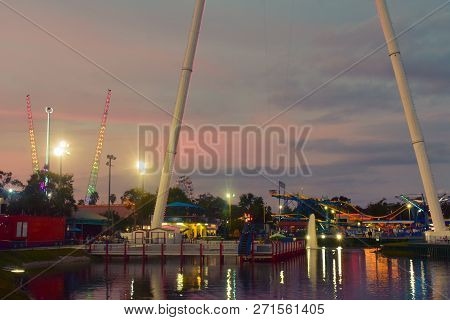 Orlando, Florida.  November 19, 2018 Colorful Attractions In Fun Spot Park On Beautiful Sunset Backg