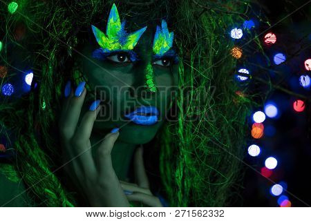 Mystic Green Dryad In Uv Fluor Black Light With Glowing Trees On Background