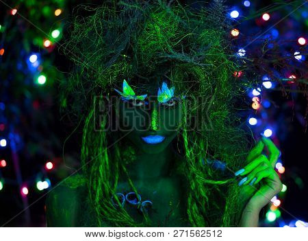 Mystic Green Dryad In Uv Fluor Black Light With Glowing Trees On Background