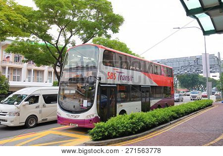 Singapore - November 16, 2018: Public Bus Drive Through Downtown Singapore.
