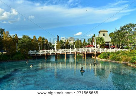 Orlando, Florida. November 24, 2018 View Of Bridge, Lamps Floating Above Lake On Lightblue Cloudy Ba