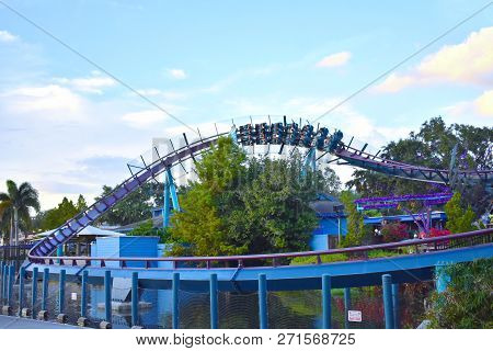 Orlando, Florida. November 24, 2018. People Having Fun Mako Rollercoaster Ride On Lightblue Cloudy B