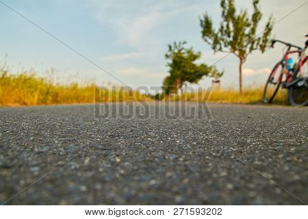 Cycle Path Asphalt, Break At The Cycling Excursion In The Evening, The Bike Stands At The Edge, Deep