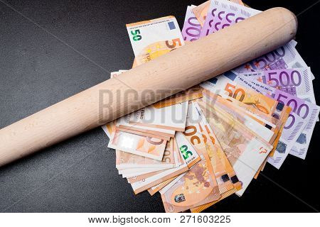 Baseball Bat With Money. Corruption Extortion Concept
