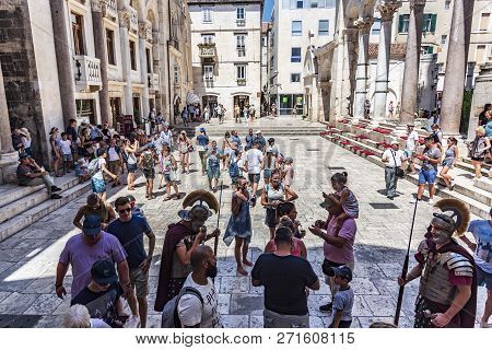 Split, Croatia - July 12, 2017: Tourists On The Square Peristil In Diocletians Palace.